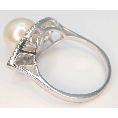 1255 - A 925 Silver Pearl and Clear Stone Set Ring. Size N 1/2. Total weight: 3.65g.