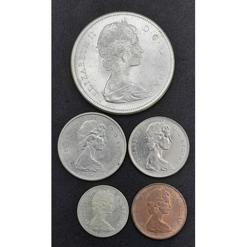 1257 - Five Canadian 1967 Coins Including an 800 Silver Canadian Dollar plus a 25, 10,5 and one cent coin.