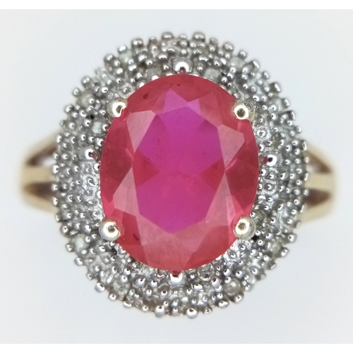 606 - AN Eye Catching Gold Gilded Sterling Silver Ruby and Illusion Set Diamond Ring Size S. The Ring is s... 