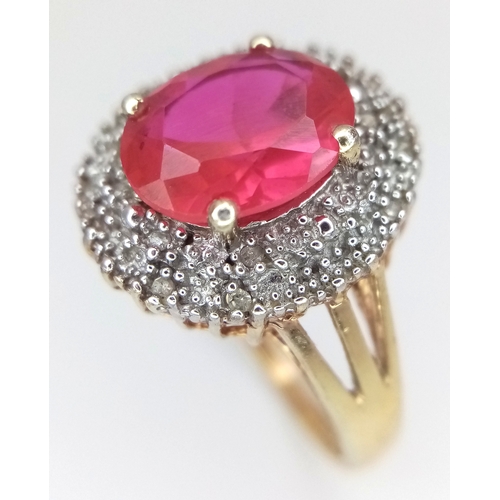 606 - AN Eye Catching Gold Gilded Sterling Silver Ruby and Illusion Set Diamond Ring Size S. The Ring is s... 