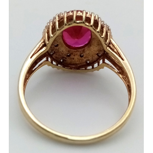 606 - AN Eye Catching Gold Gilded Sterling Silver Ruby and Illusion Set Diamond Ring Size S. The Ring is s... 