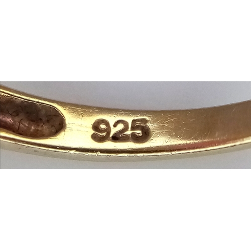 606 - AN Eye Catching Gold Gilded Sterling Silver Ruby and Illusion Set Diamond Ring Size S. The Ring is s... 