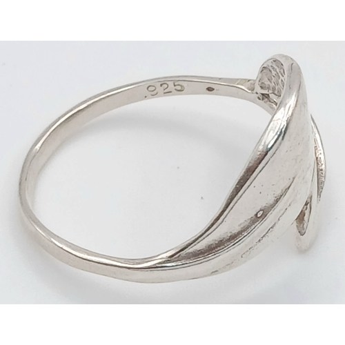 1209 - A 925 Silver Crossover Ring. Leaf form. Size T, 2.16g weight.