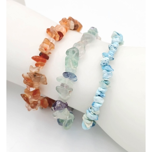 1210 - A Collection of Three Unworn Stretch Fit Semi-Precious Gemstone Bracelets Comprising: 1) Turquoise, ... 
