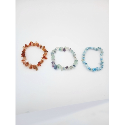 1210 - A Collection of Three Unworn Stretch Fit Semi-Precious Gemstone Bracelets Comprising: 1) Turquoise, ... 