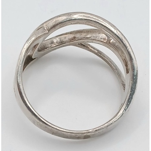 1223 - A 925 Silver Modernist Openwork Ring. Size P, 4.43g weight.