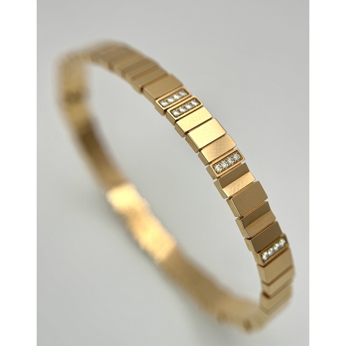 12 - A Dior 18K rose gold and diamond bangle. Total weight 19.676G. Measure: 6cmx4cm. Comes with card of ... 