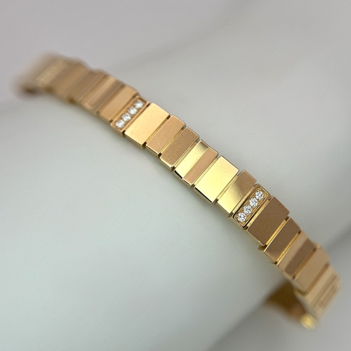 12 - A Dior 18K rose gold and diamond bangle. Total weight 19.676G. Measure: 6cmx4cm. Comes with card of ... 
