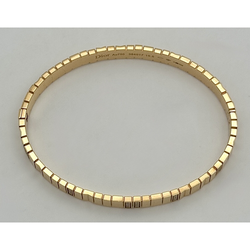 12 - A Dior 18K rose gold and diamond bangle. Total weight 19.676G. Measure: 6cmx4cm. Comes with card of ... 