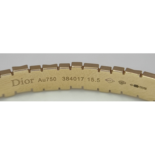 12 - A Dior 18K rose gold and diamond bangle. Total weight 19.676G. Measure: 6cmx4cm. Comes with card of ... 