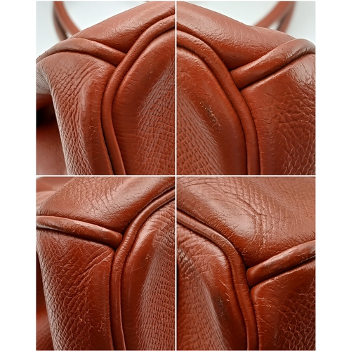 33 - An Hermès Brick Red Courchevel Birkin 35 Handbag. Brick red Courchevel leather exterior with silver-... 
