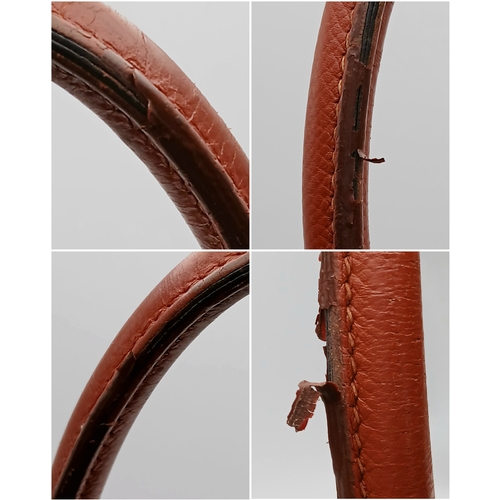 33 - An Hermès Brick Red Courchevel Birkin 35 Handbag. Brick red Courchevel leather exterior with silver-... 