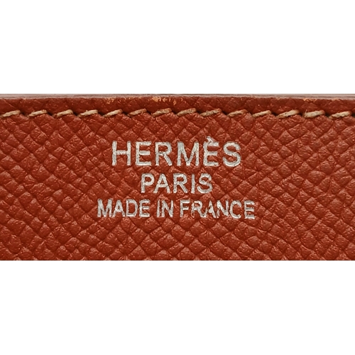 33 - An Hermès Brick Red Courchevel Birkin 35 Handbag. Brick red Courchevel leather exterior with silver-... 