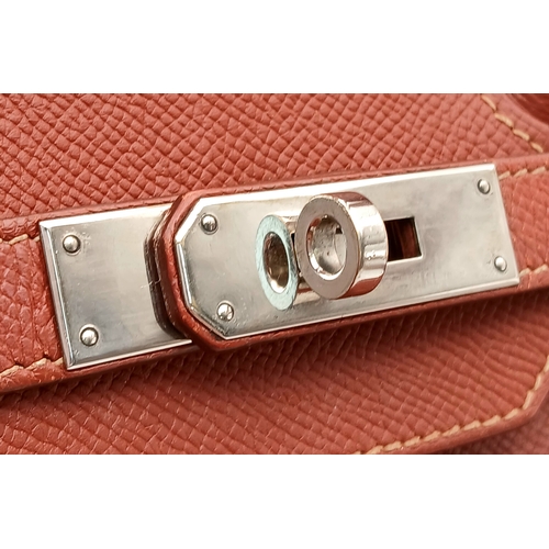 33 - An Hermès Brick Red Courchevel Birkin 35 Handbag. Brick red Courchevel leather exterior with silver-... 