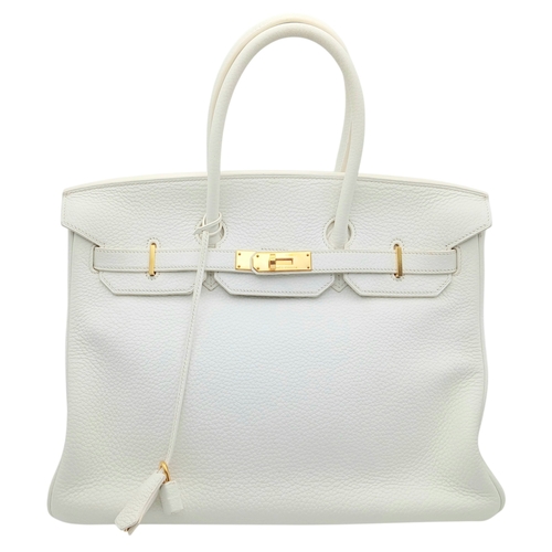 47 - An Hermès White Togo Birkin 35 Handbag. White grained calfskin leather exterior with gold-toned hard... 