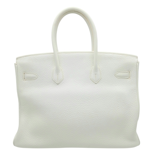47 - An Hermès White Togo Birkin 35 Handbag. White grained calfskin leather exterior with gold-toned hard... 