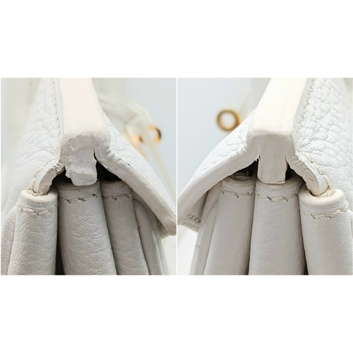 47 - An Hermès White Togo Birkin 35 Handbag. White grained calfskin leather exterior with gold-toned hard... 