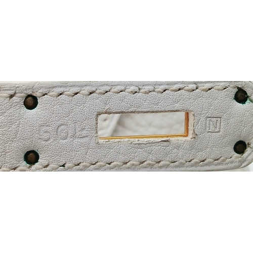 47 - An Hermès White Togo Birkin 35 Handbag. White grained calfskin leather exterior with gold-toned hard... 