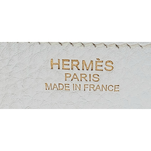 47 - An Hermès White Togo Birkin 35 Handbag. White grained calfskin leather exterior with gold-toned hard... 