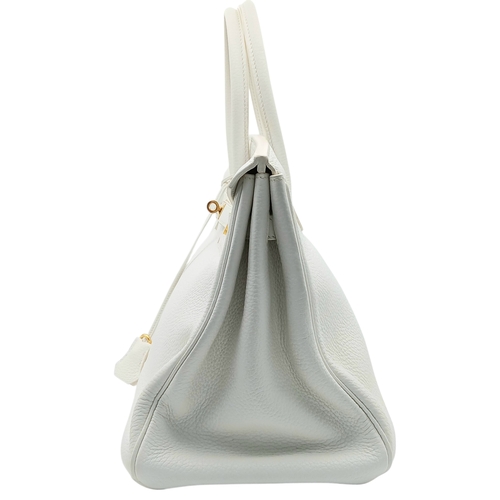 47 - An Hermès White Togo Birkin 35 Handbag. White grained calfskin leather exterior with gold-toned hard... 