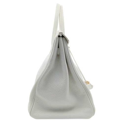47 - An Hermès White Togo Birkin 35 Handbag. White grained calfskin leather exterior with gold-toned hard... 