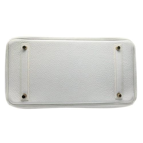 47 - An Hermès White Togo Birkin 35 Handbag. White grained calfskin leather exterior with gold-toned hard... 