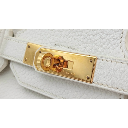 47 - An Hermès White Togo Birkin 35 Handbag. White grained calfskin leather exterior with gold-toned hard... 