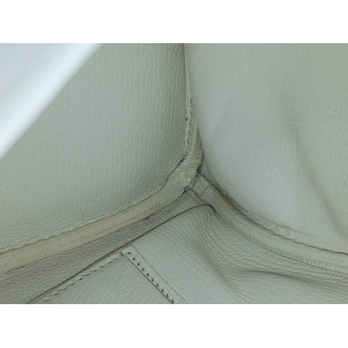47 - An Hermès White Togo Birkin 35 Handbag. White grained calfskin leather exterior with gold-toned hard... 