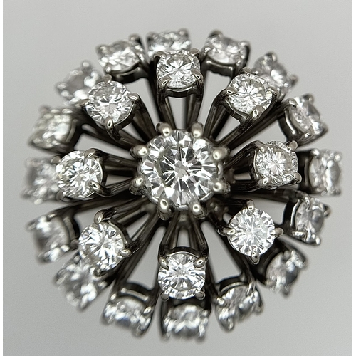 51 - An 18k Gold and Diamond Starburst Cluster Cocktail Ring. c. 4ctw of round brilliants cut diamonds ha... 