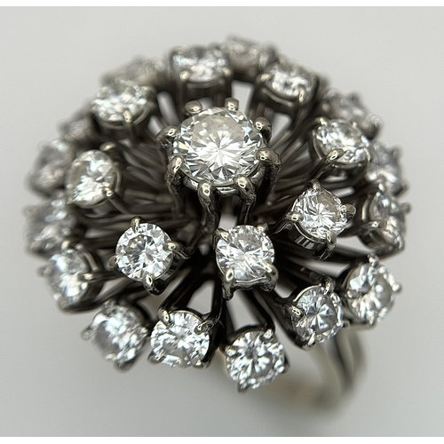 51 - An 18k Gold and Diamond Starburst Cluster Cocktail Ring. c. 4ctw of round brilliants cut diamonds ha... 
