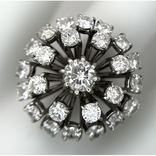 51 - An 18k Gold and Diamond Starburst Cluster Cocktail Ring. c. 4ctw of round brilliants cut diamonds ha... 