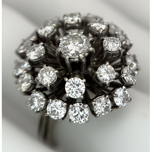 51 - An 18k Gold and Diamond Starburst Cluster Cocktail Ring. c. 4ctw of round brilliants cut diamonds ha... 