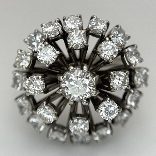 51 - An 18k Gold and Diamond Starburst Cluster Cocktail Ring. c. 4ctw of round brilliants cut diamonds ha... 