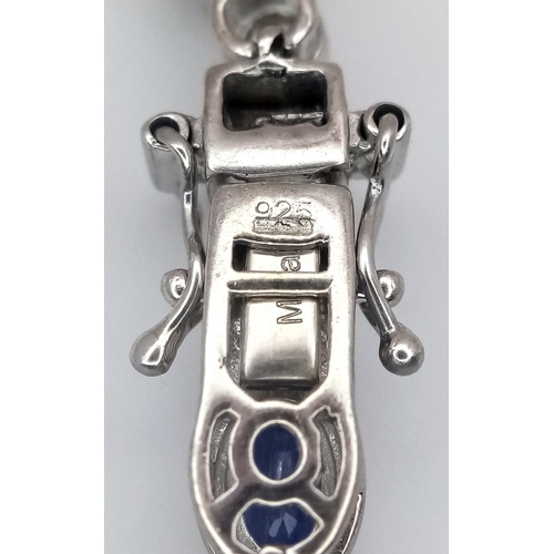 592 - A Beautiful Sterling Silver Blue and White Topaz Tennis Bracelet-19cm Length. Set with 6 x 4mm Oval ... 