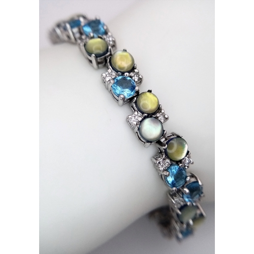 599 - A Pretty Sterling Silver Multi-Colour Gemstone Bracelet-19.5cm Length, 8mm Width. The Bracelet has a... 