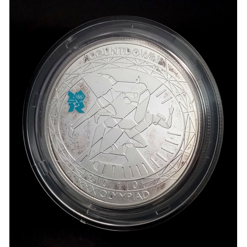 604 - A Royal Mint Sterling Silver London Olympics Commemorative Proof Coin. £5 denomination. 28.28g. Come... 