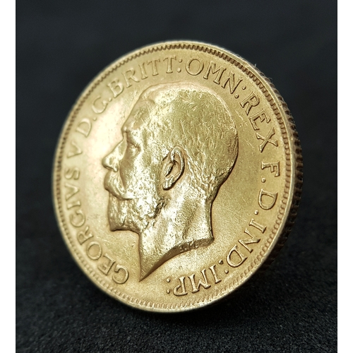 596 - A 1911 George V Full Sovereign Coin. 22k Gold.
