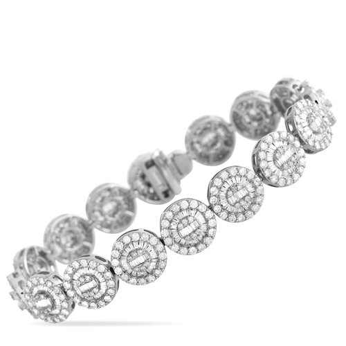 An 18K White Gold 7.30ct Diamond Bracelet. Crafted from opulent 18K white gold, a series of circular links come to life thanks to a dazzling arrangement of diamonds with a total weight of 7.30 carats. This impressive accessory measures 7.0 inches long. Excellent Condition condition and includes a gift box. Total weight: 25.2 grams. *This item is held at Cadmore USA Office in Pennsylvania, USA and will be shipped from there. Buyers will be responsible for direct shipping payments.*