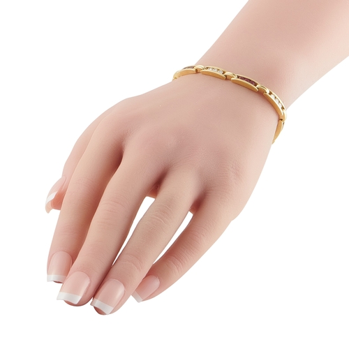 1221 - An 18K Yellow Gold 1.0ct Diamond and Ruby Bracelet. Channel-set Diamonds with a total weight of 1.0 ... 