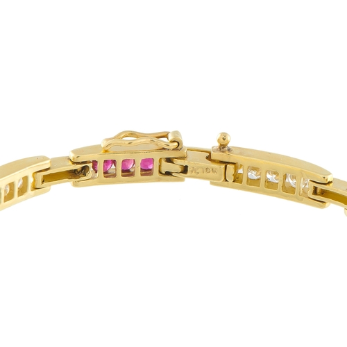 1221 - An 18K Yellow Gold 1.0ct Diamond and Ruby Bracelet. Channel-set Diamonds with a total weight of 1.0 ... 