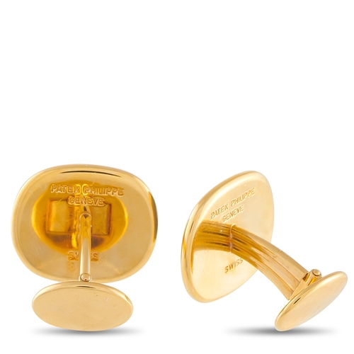 1488 - A pair of Patek Philippe 18K Yellow Gold Cufflinks. A fierce tiger motif makes a statement at the ce... 