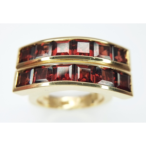 An 18K Yellow Gold Articulated Two Row Garnet Ring by Garrard ...