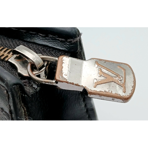 607 - A Louis Vuitton Monogram Eclipse Pochette Voyage. Black canvas exterior with silver-toned hardware a... 