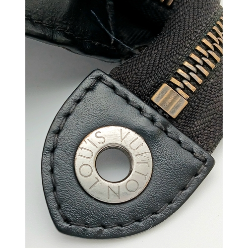 607 - A Louis Vuitton Monogram Eclipse Pochette Voyage. Black canvas exterior with silver-toned hardware a... 