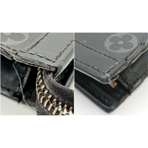 607 - A Louis Vuitton Monogram Eclipse Pochette Voyage. Black canvas exterior with silver-toned hardware a... 