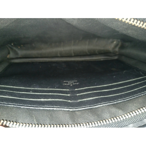 607 - A Louis Vuitton Monogram Eclipse Pochette Voyage. Black canvas exterior with silver-toned hardware a... 