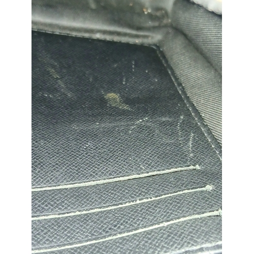 607 - A Louis Vuitton Monogram Eclipse Pochette Voyage. Black canvas exterior with silver-toned hardware a... 