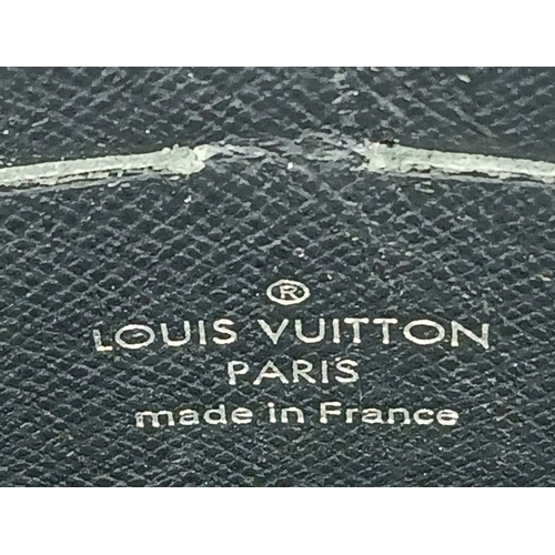 607 - A Louis Vuitton Monogram Eclipse Pochette Voyage. Black canvas exterior with silver-toned hardware a... 