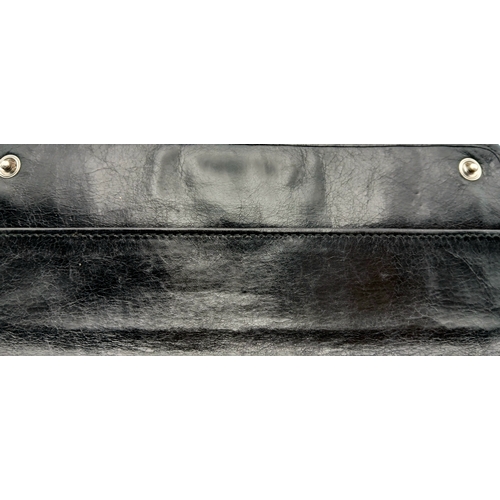 579 - A Miu Miu Nappa Matelassé Flap Wallet. Black matelassé pleated leather exterior with silver-toned lo... 
