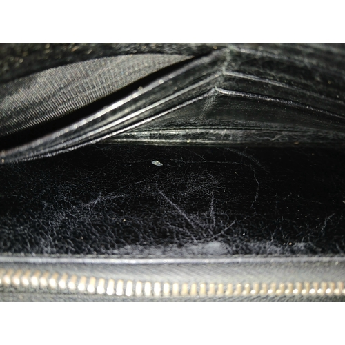579 - A Miu Miu Nappa Matelassé Flap Wallet. Black matelassé pleated leather exterior with silver-toned lo... 